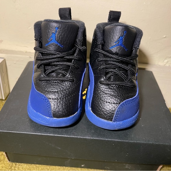 Jordan 12 Retro
Black Game Royal
(TD) Worn once to a birthday party - Picture 1 of 6